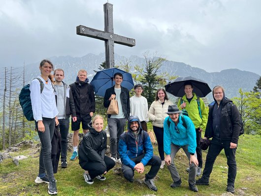 The picture shows young students at the summit cross.